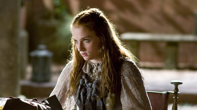 Sansa (Sophie Turner) reading a book in Game of Thrones