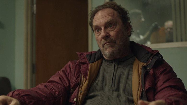 Stephen Root as Fuches sitting in Barry