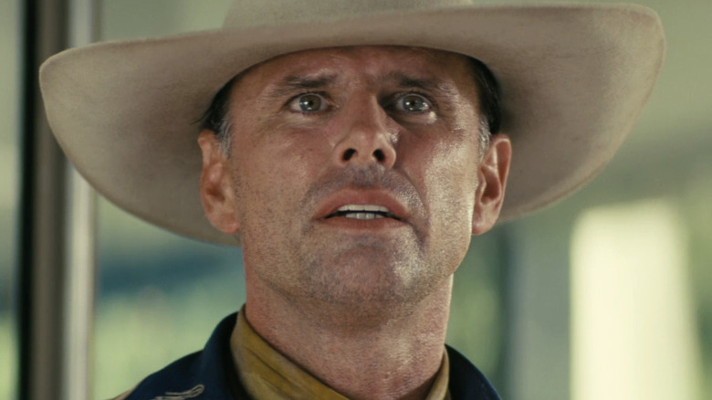 Walton Goggin as The Ghoul looking scared in a cowboy hat in Fallout