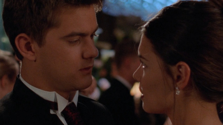 Pacey and Joey looking at each other while dancing, close up