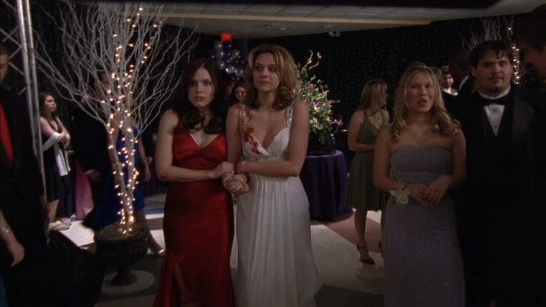 Brooke and Peyton walking into prom with blood on them
