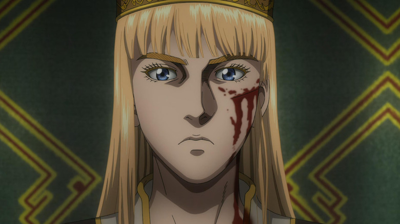 Princess Canute frowns with a cut on her cheek in Vinland Saga.