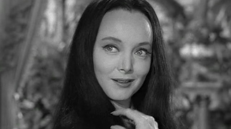 Carolyn Jones as Morticia Addams smiling in The Addams Family
