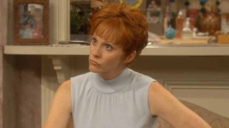 Reba McEntire as Reba Hart frowning in Reba