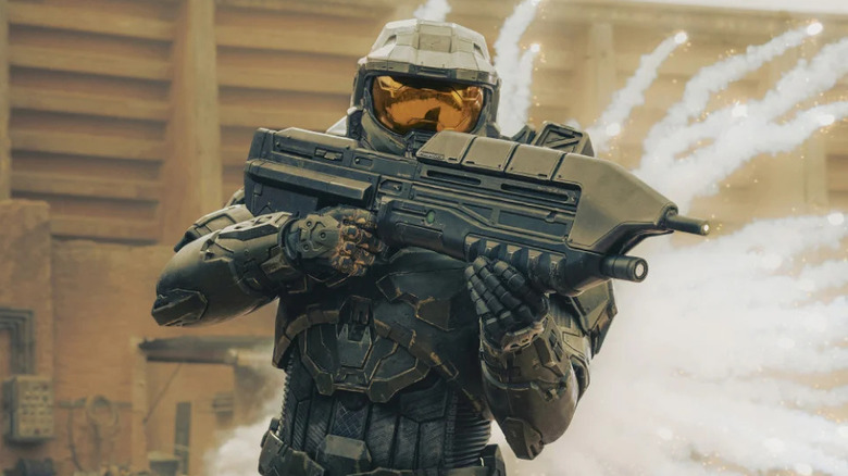 Pablo Schreiber as Master Chief , running from an explosion in Halo.