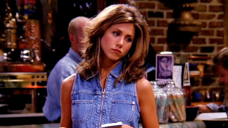 Rachel Green walks through a cafe in Friends