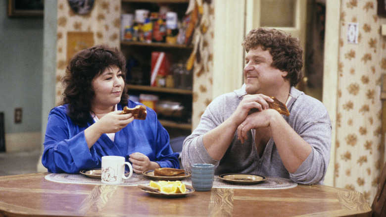 Rosanne Conner smiling at Dan Conner in Rosanne