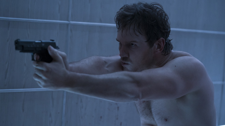Chris Pratt as James Reece shirtless and pointing gun in The Terminal List
