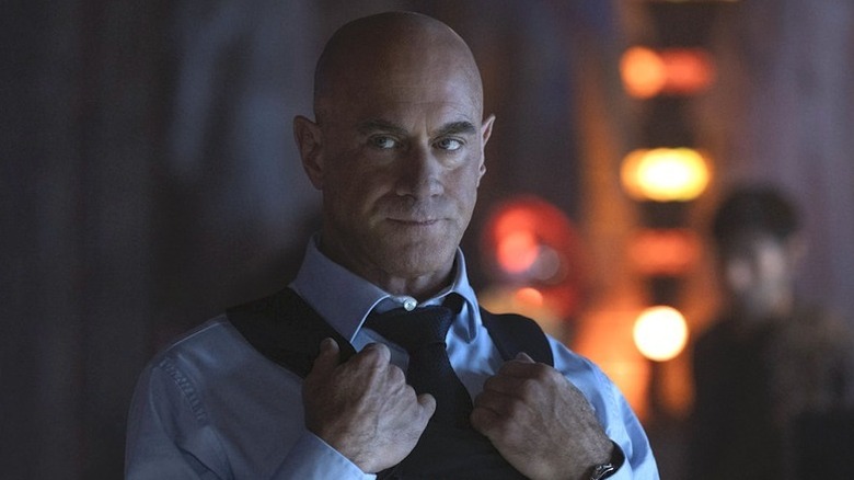 Elliot Stabler (Christopher Meloni) stands solemnly holding his bulletproof vest in Law & Order: Organized Crime