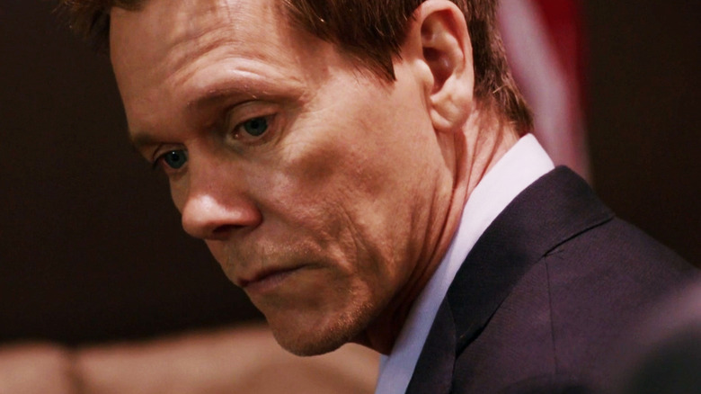 Ryan Hardy (Kevin Bacon) looks contemplatively downward in The Following