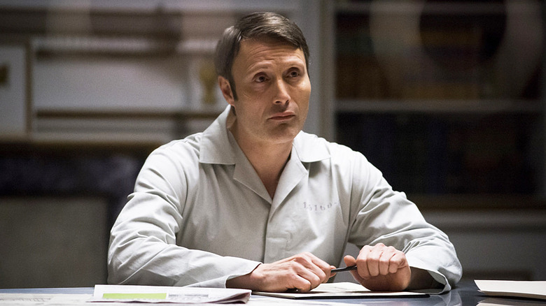 Mads Mikkelsen as Dr. Hannibal Lecter, in a prison uniform in Hannibal.