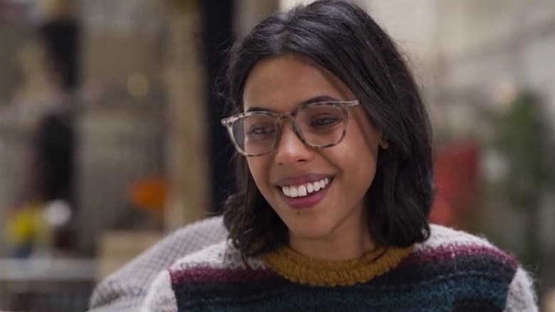 Elsa (Zita Hanrot) smiling and looking down in The Hookup Plan