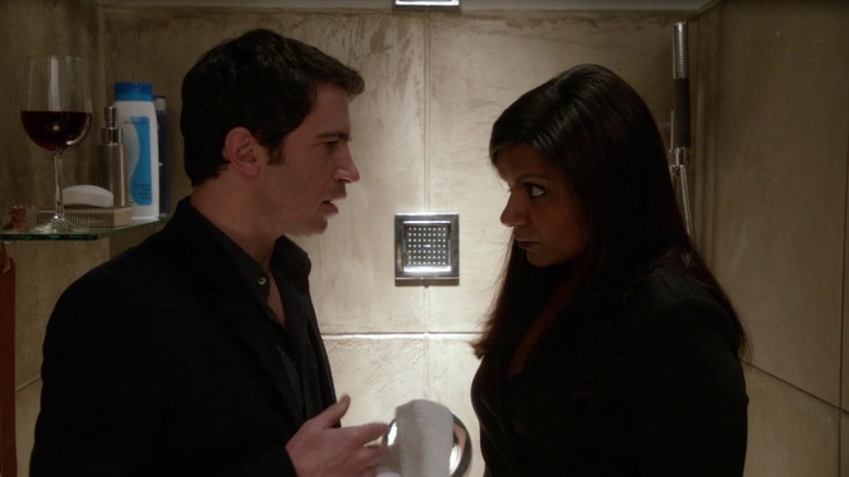 Danny and Mindy standing face to face in formal attire in a shower stall on The Mindy Project S1E20