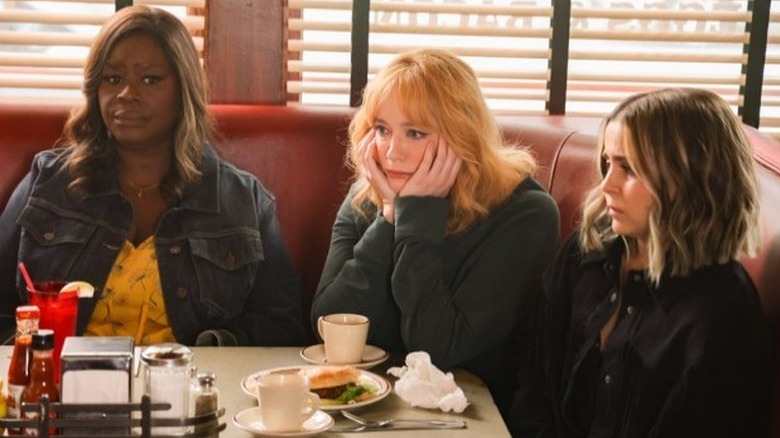 Retta as Ruby, Christina Hendricks as Beth, and Mae Whitman as Annie sitting around restaurant booth in Good Girls