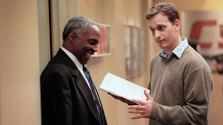 Josh Charles as Dan Rydell laughs with Robert Guillaume as Isaac Jaffe in Sports Night
