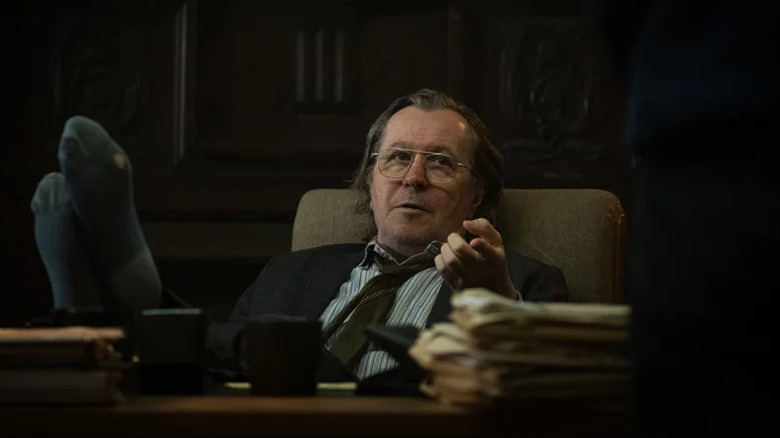 Gary Oldman's Jackson Lamb with his feet on the table on Slow Horses