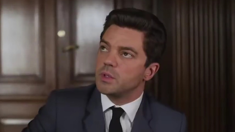 Dominic Cooper's Fielding Scott looking up on Spy City