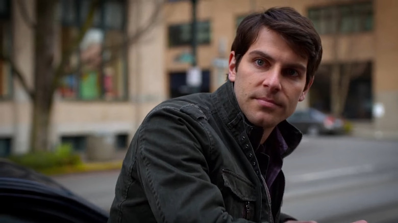 David Giuntoli's Nick Burkhardt looking over his shoulder in Grimm