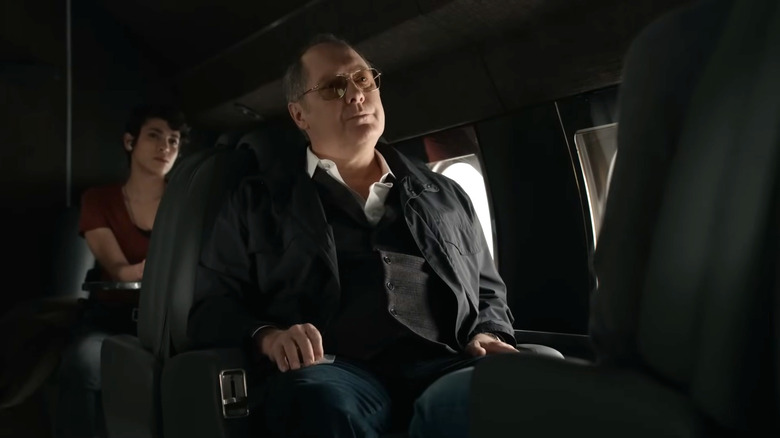 James Spader's Raymond Reddington sitting in a plane seat in The Blacklist