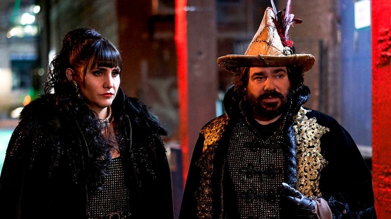 Nadja with Laszlo wearing a skin hat in What We Do in the Shadows