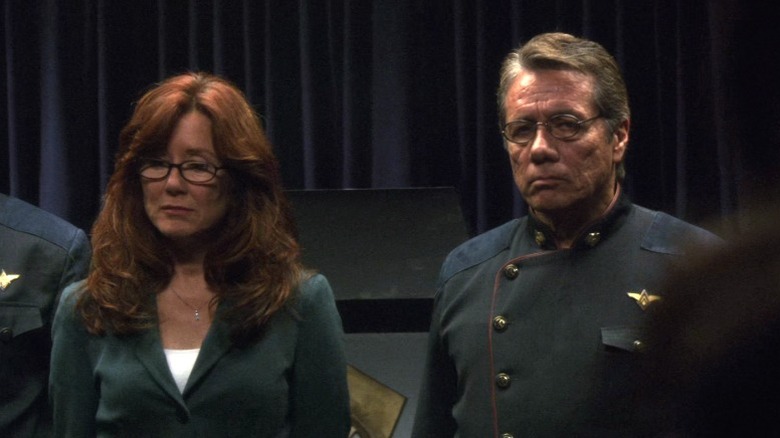 President Roslin and Admiral Adama standing side by side on Battlestar Galactica S3E11