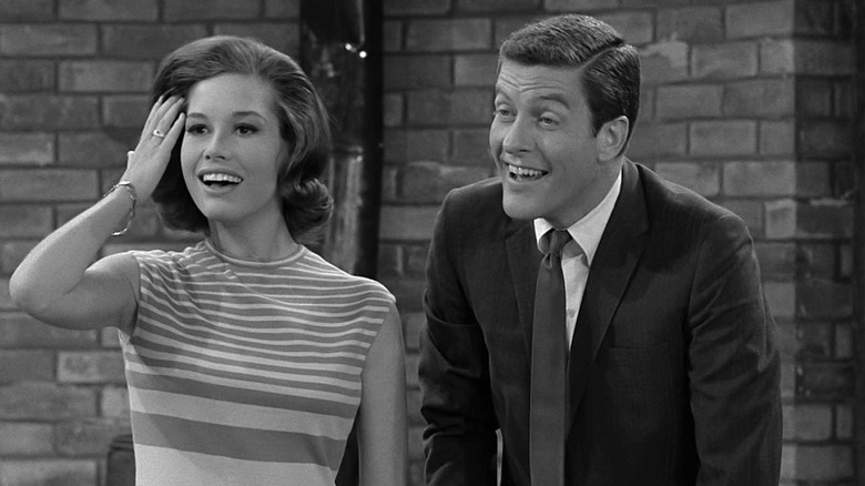 Laura (Mary Tyler Moore) and Rob (Dick Van Dyke) are amused in The Dick Van Dyke Show