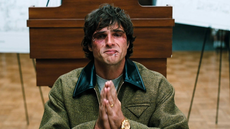 Jacob Elordi as Nate Jacobs, kneeling and praying in Euphoria.