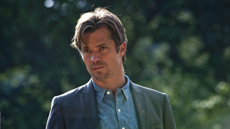 Timothy Olyphant as Raylan Givens looking stern in Justified