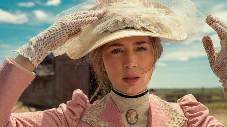 Emily Blunt as Cornelia Locke holds onto her hat in The English