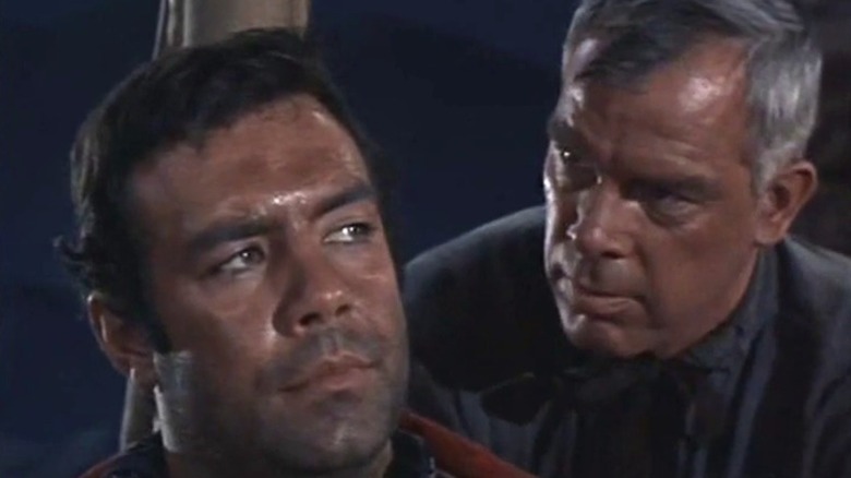 Kane standing behind Adam on Bonanza S3E28
