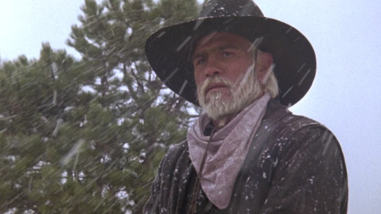 Call on horseback under falling snow on Lonesome Dove S1E4