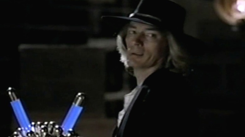 Bly standing before the Orb and looking to his left on The Adventures of Brisco County Jr. S1E20