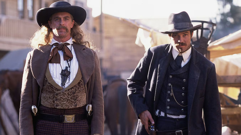 Keith Carradine and Timothy Olyphant as Wild Bill and Seth Bullock, walking down the street in Deadwood.