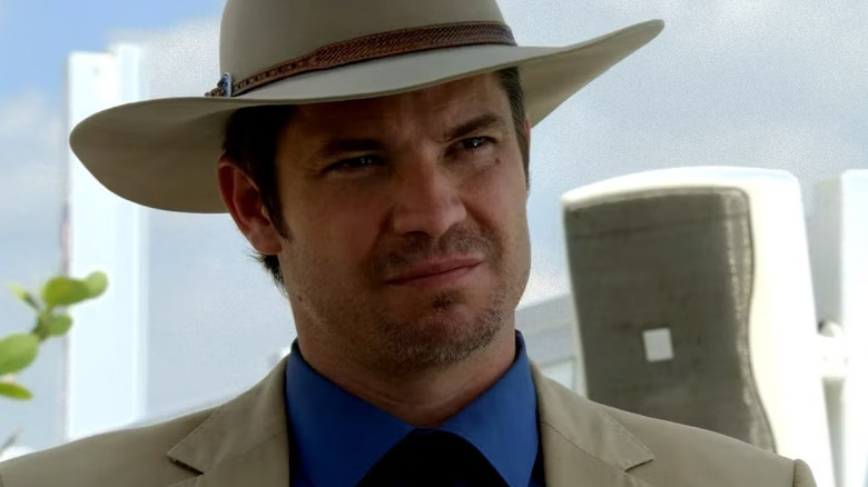 Timothy Olyphant as Raylan Givens scowls in Justified.