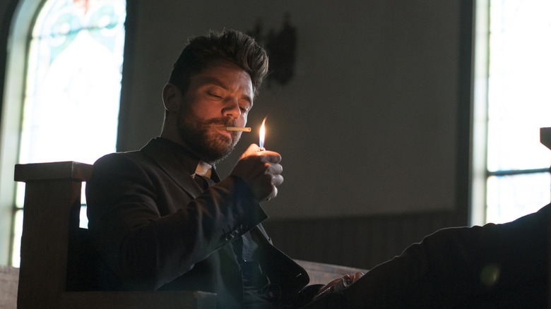Dominic Cooper as Jesse Custer, smoking a cigarette in Preacher.