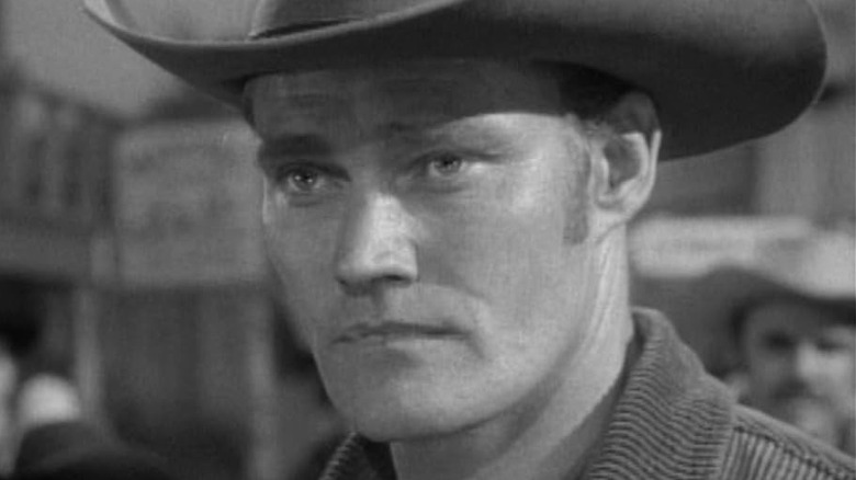 Chuck Connors as Lucas McCain, looking worried in The Rifleman.