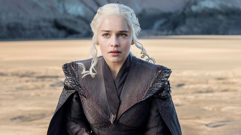 Emilia Clarke as Daenerys kneeling in Game of Thrones