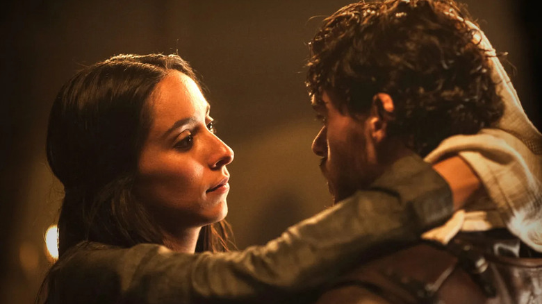 Oona Chaplin as Talisa embracing Richard Madden as Robb Stark in Game of Thrones