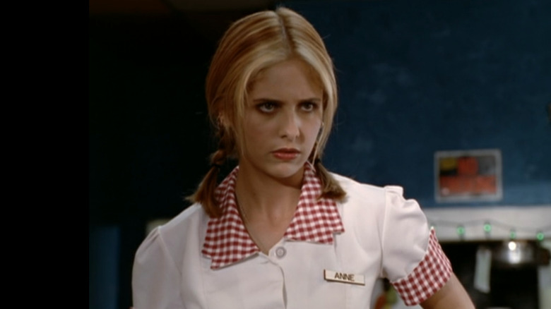 Sarah Michelle Gellar as Buffy Summers wearing a waitress uniform and looking concerned in "Buffy the Vampire Slayer."