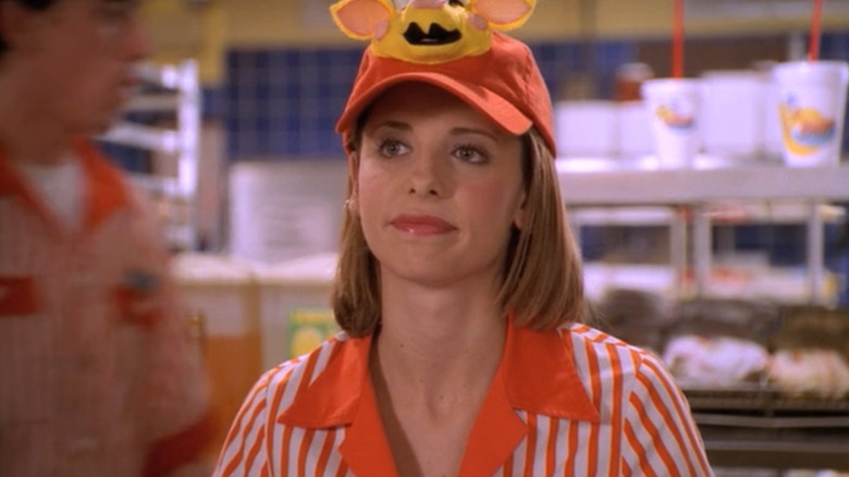 Sarah Michelle Gellar as Buffy wearing her Doublemeat Palace hat and working in "Buffy the Vampire Slayer."