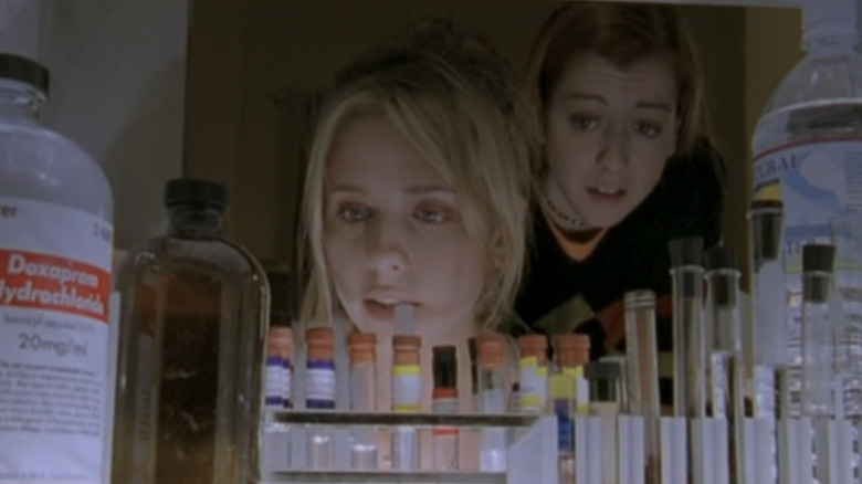 Sarah Michelle Gellar as Buffy looking inside a hospital fridge alongside Alyson Hannigan as Willow in "Buffy the Vampire Slayer."
