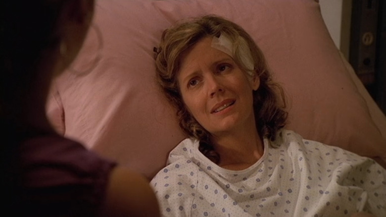 Kristine Sutherland as Joyce laying in a hospital bed with a bandage on her head in "Buffy the Vampire Slayer."
