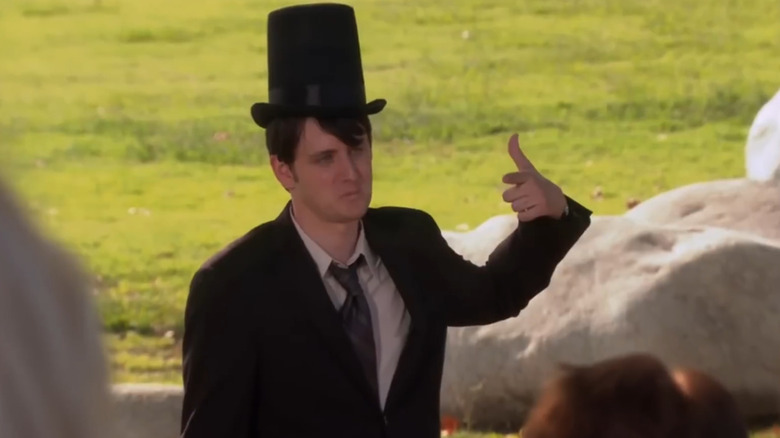 Zach Woods as Gabe Lewis wears a tall hat on The Office