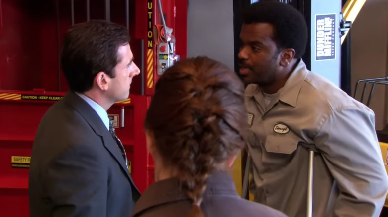 Steve Carell as Michael Scott talks to Craig Robinson as Darryl Philbin on The Office