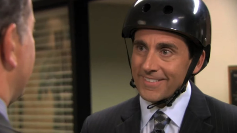 Steve Carell as Michael Scott wears a bike helmet on The Office