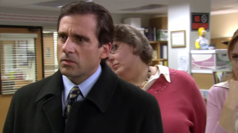 Steve Carell as Michael Scott stands next to Phyllis Lapin as Phyllis Smith on The Office