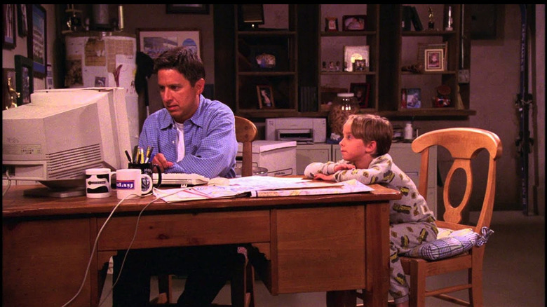 Ray Romano as Ray Barone types on a computer next to Sullivan Sweeten as Michael Barone on Everybody Loves Raymond