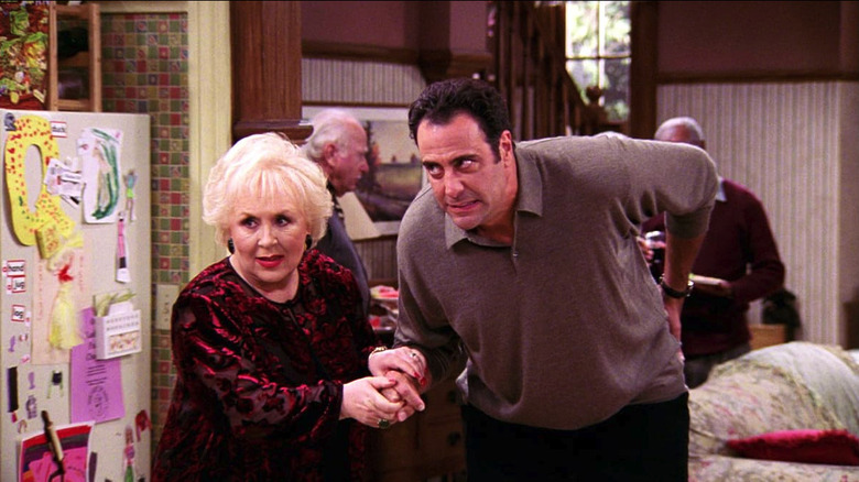 Doris Roberts as Marie Barone grabs Brad Garrett as Robert Barone on Everybody Loves Raymond