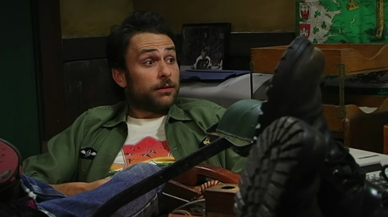 Charlie sitting with his eyebrows raised on It's Always Sunny in Philadelphia S5E11