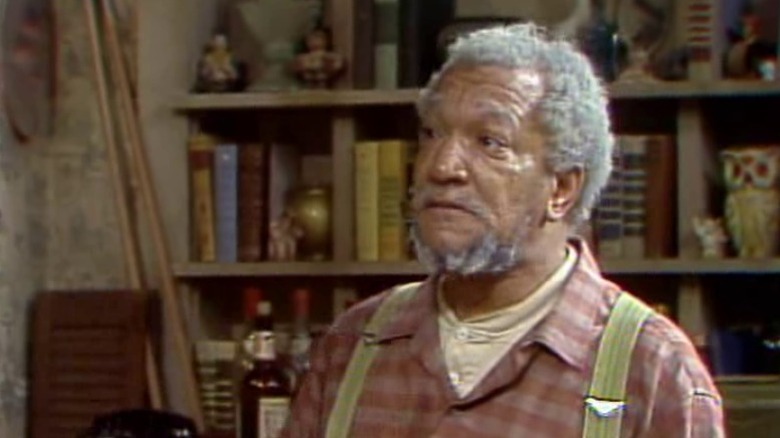 Fred staring sternly with his eyebrows raised on Sanford & Son S2E6